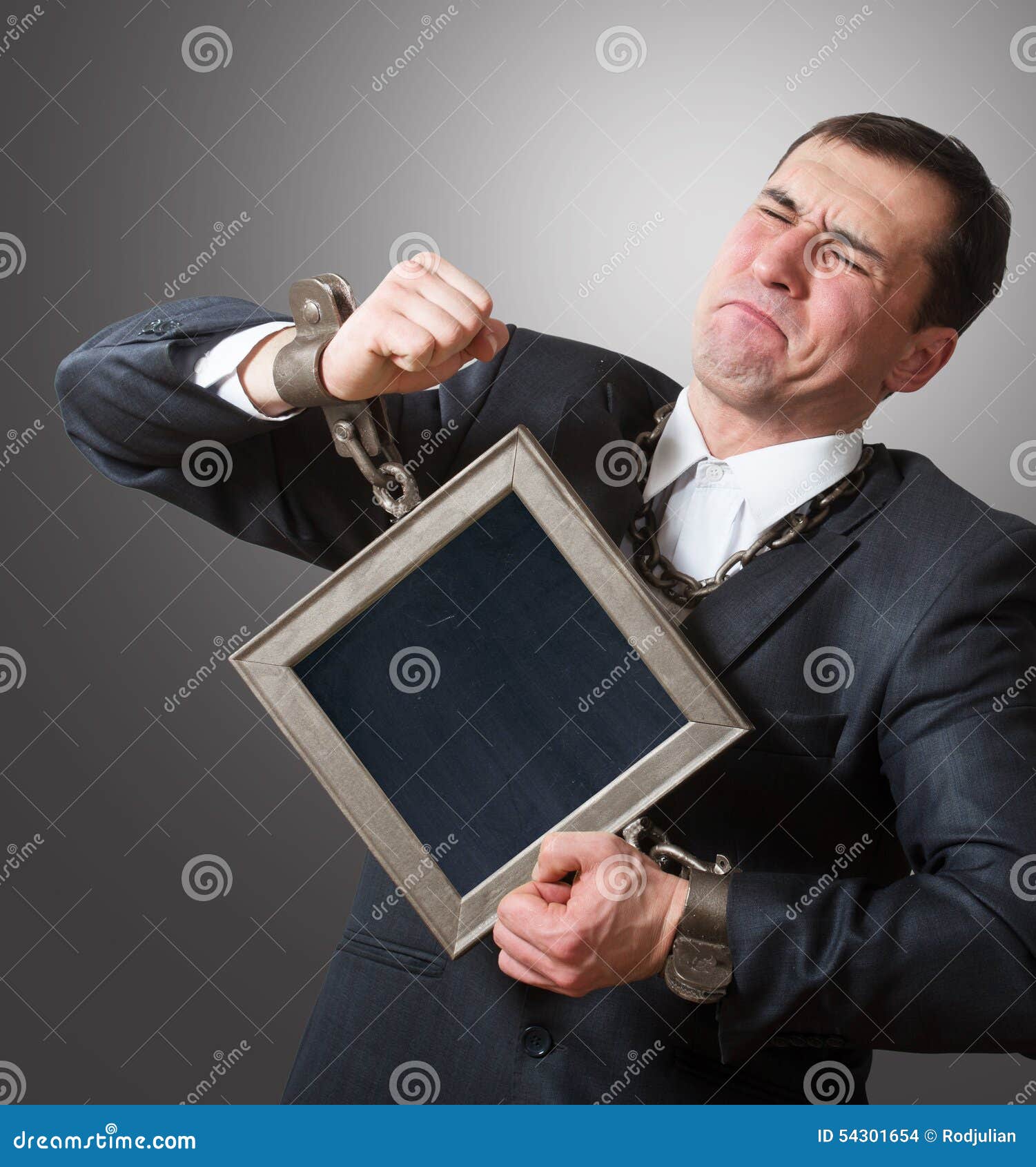 chained businessman with a board