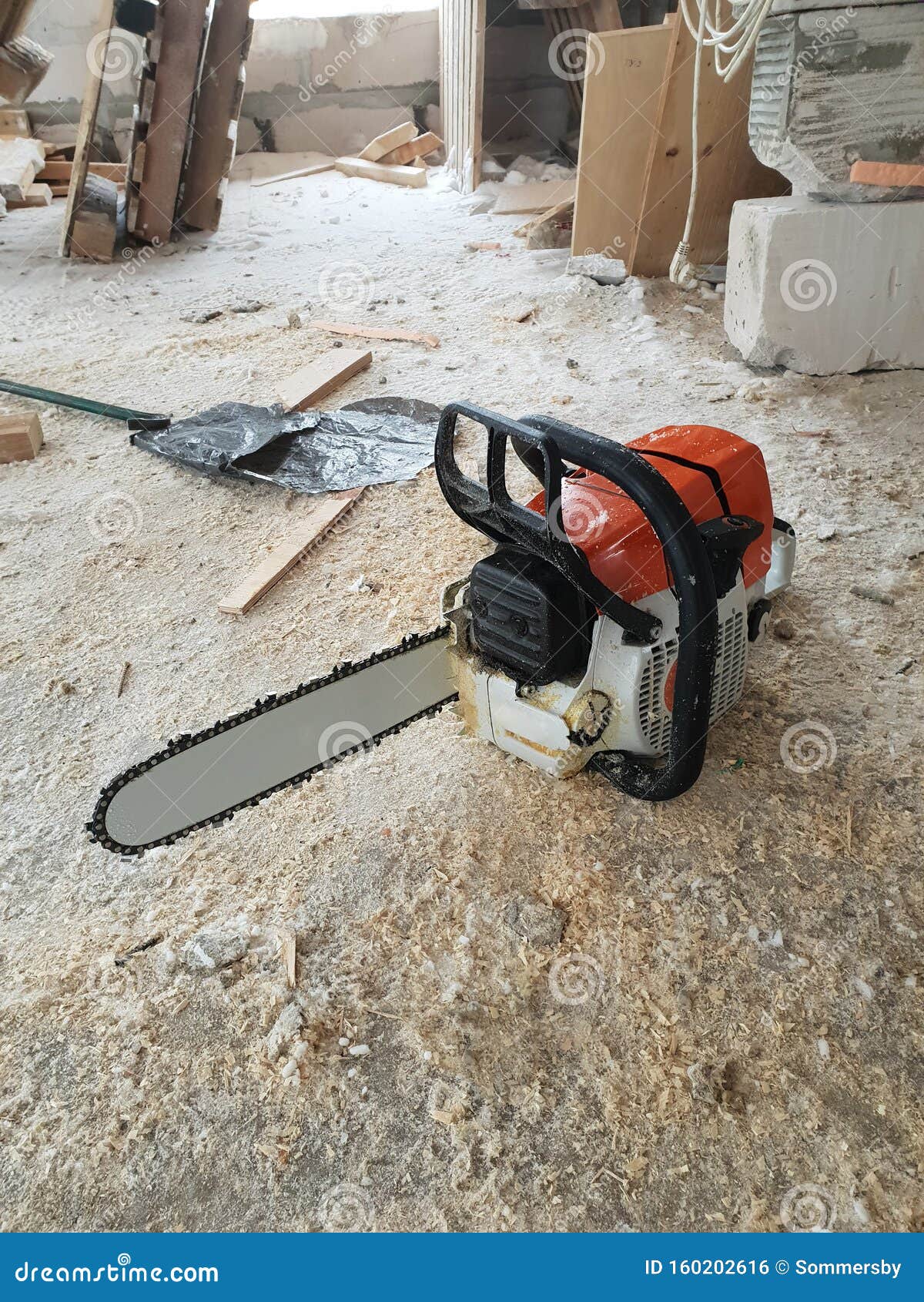 Chainsaw Is Strewn With Sawdust On The Floor In Country House