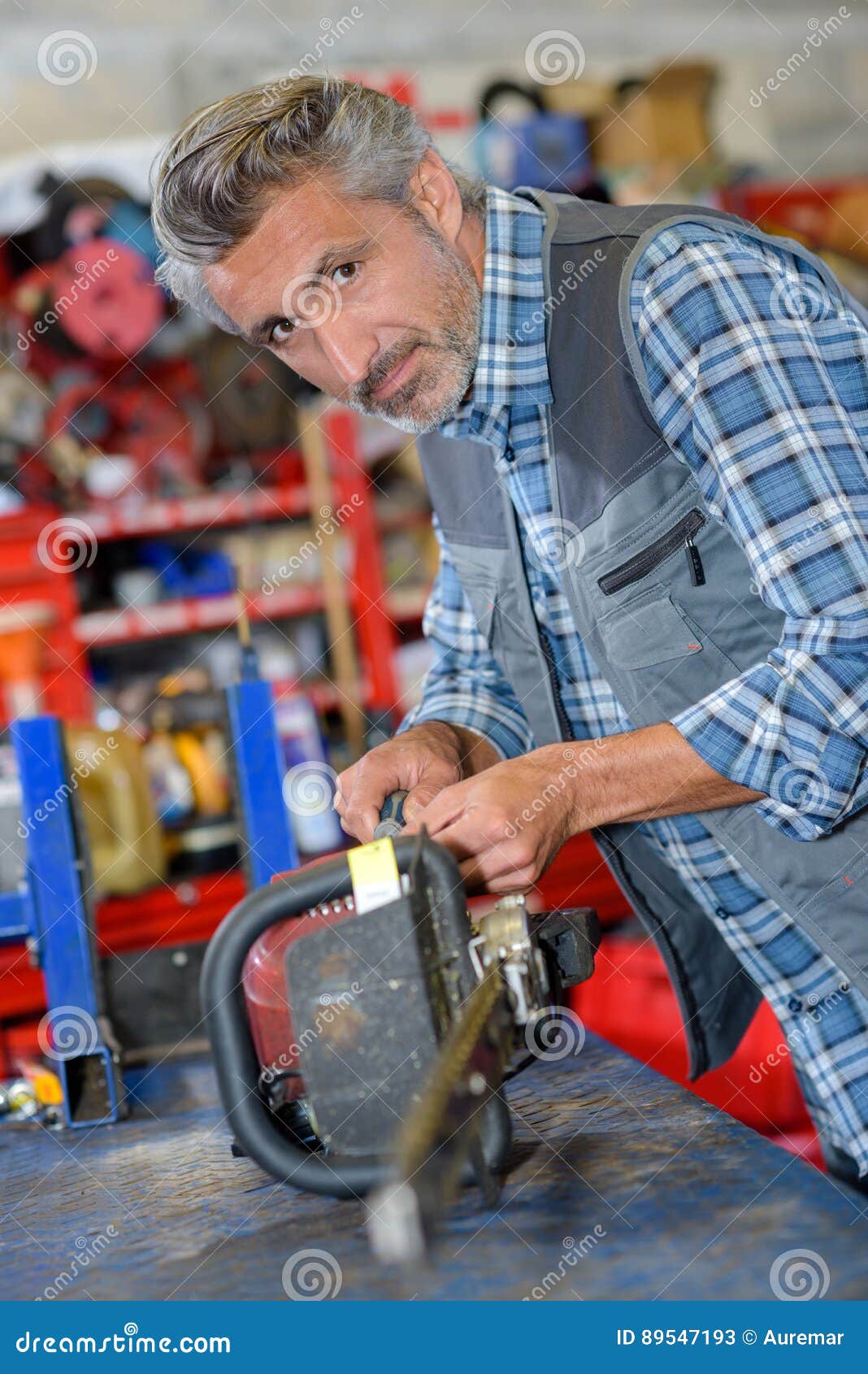 Chainsaw Technician Fixing Electric Saw Stock Image Image of outdoor