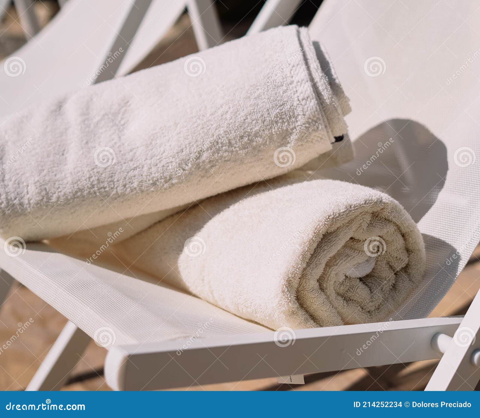 hotel pool chair with folded towels