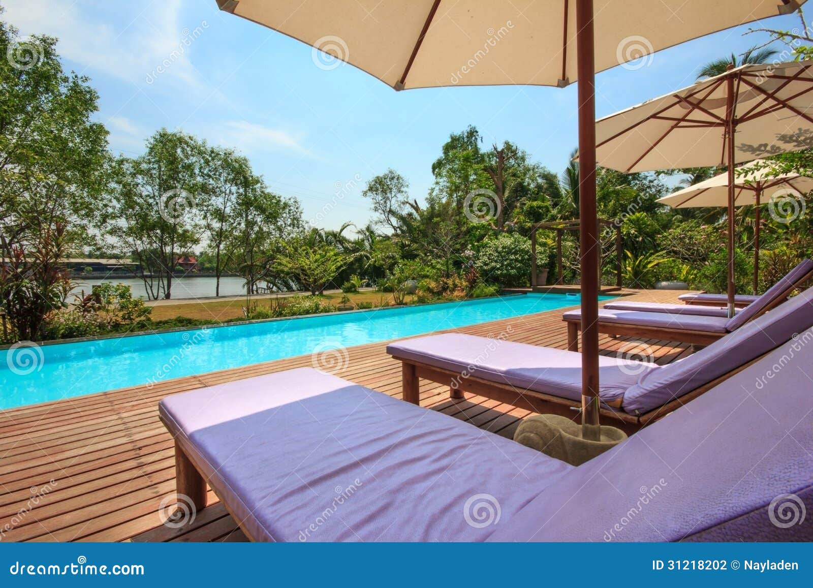 Chair beside the pool stock photo. Image of summer, design 31218202