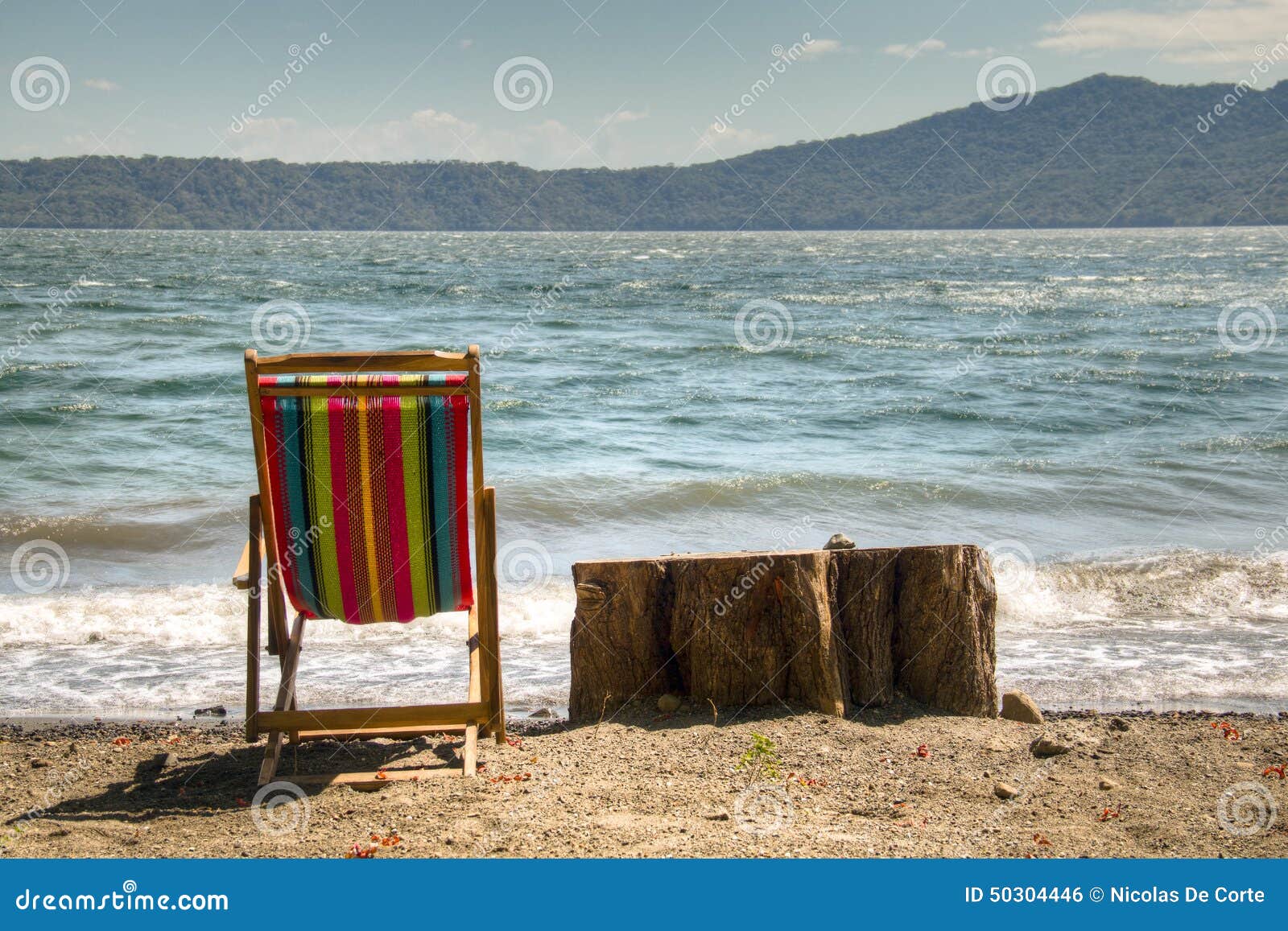 chair at the shore of lake apoyo near granada, nicaragua