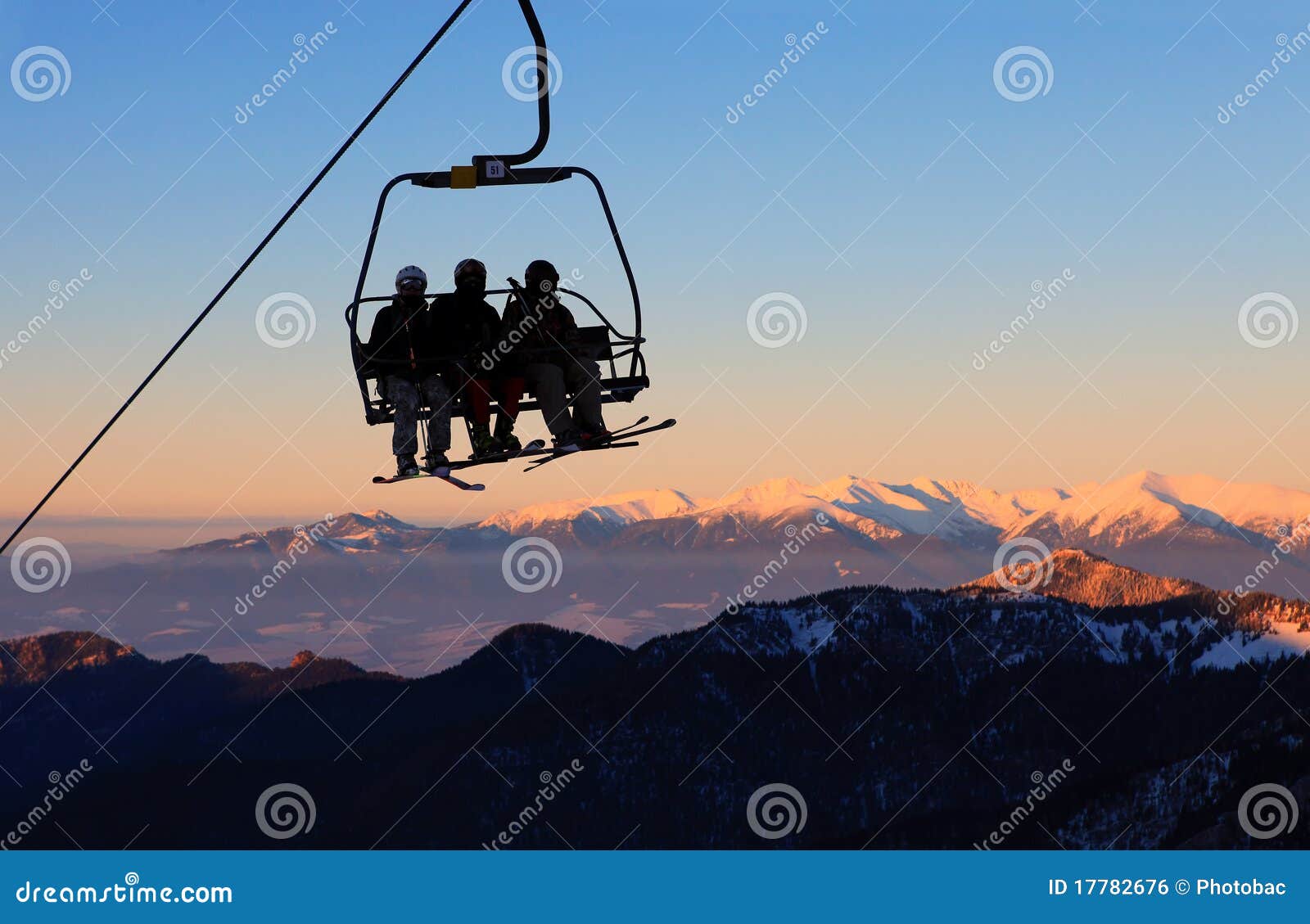 chair ski lift with skiers