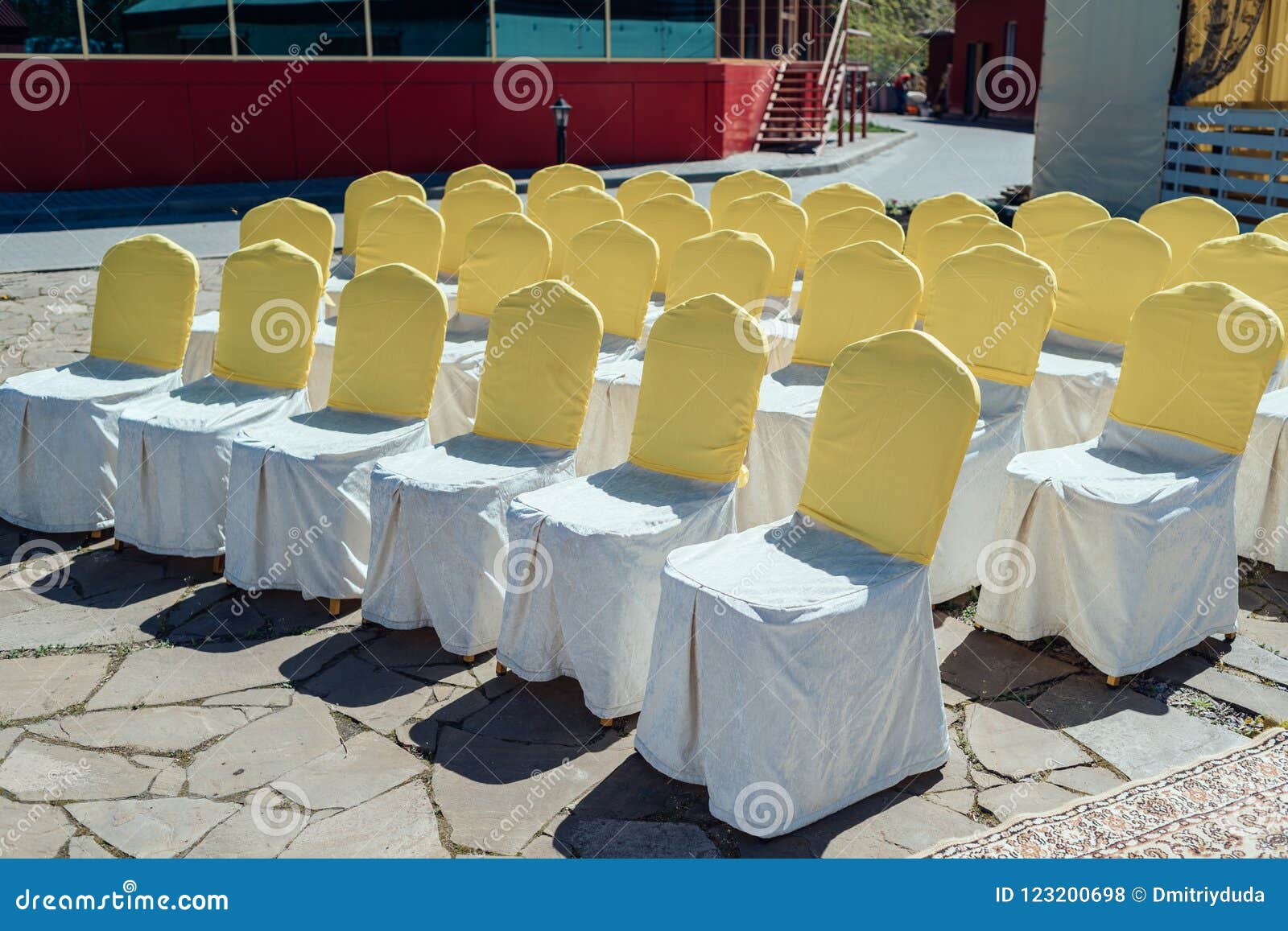 Chairs for Guests on Wedding Ceremony with White and Yellow Satin ...