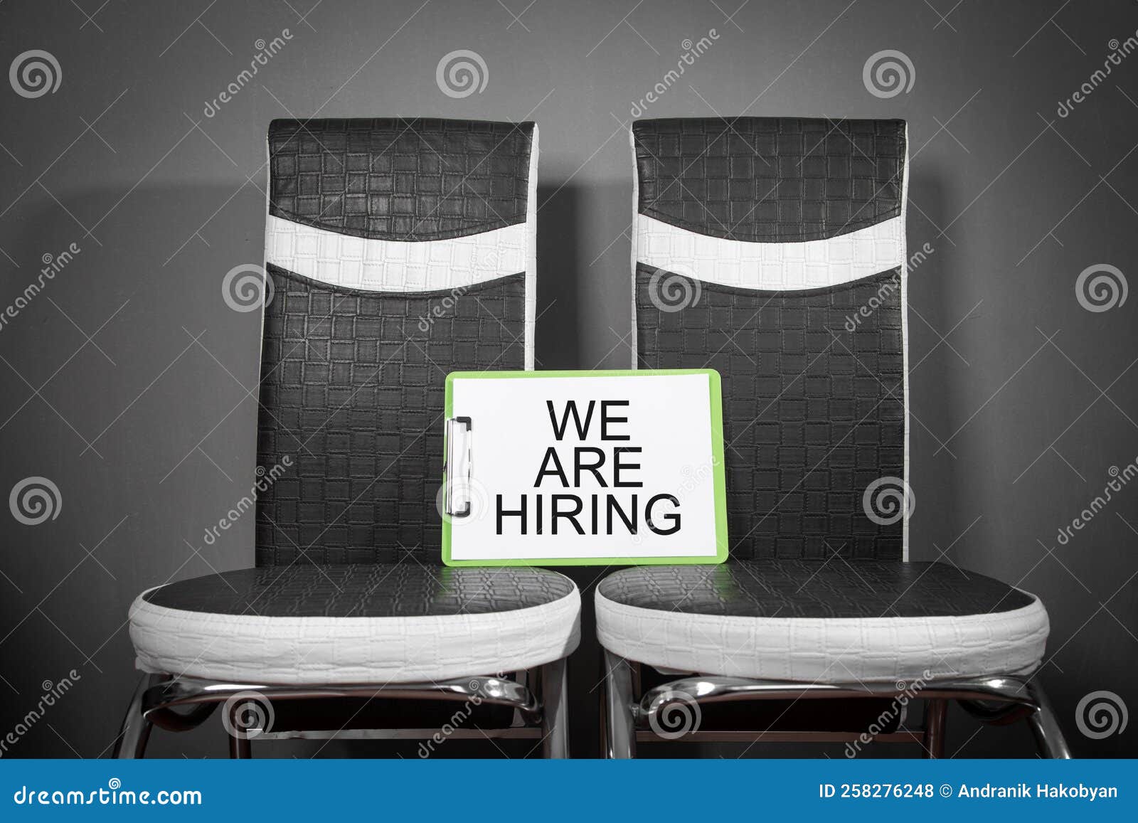 Chairs with a we are Hiring Message. Concept of Hiring and Recruiting