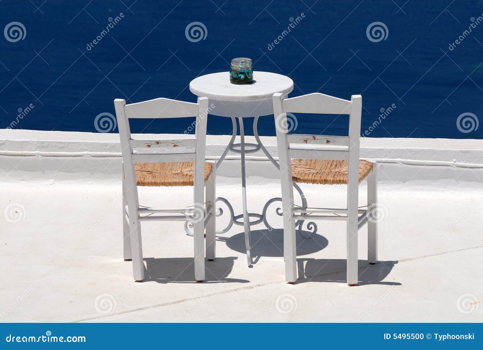 Chairs on the roof terrace stock photo. Image of santorini 5495500