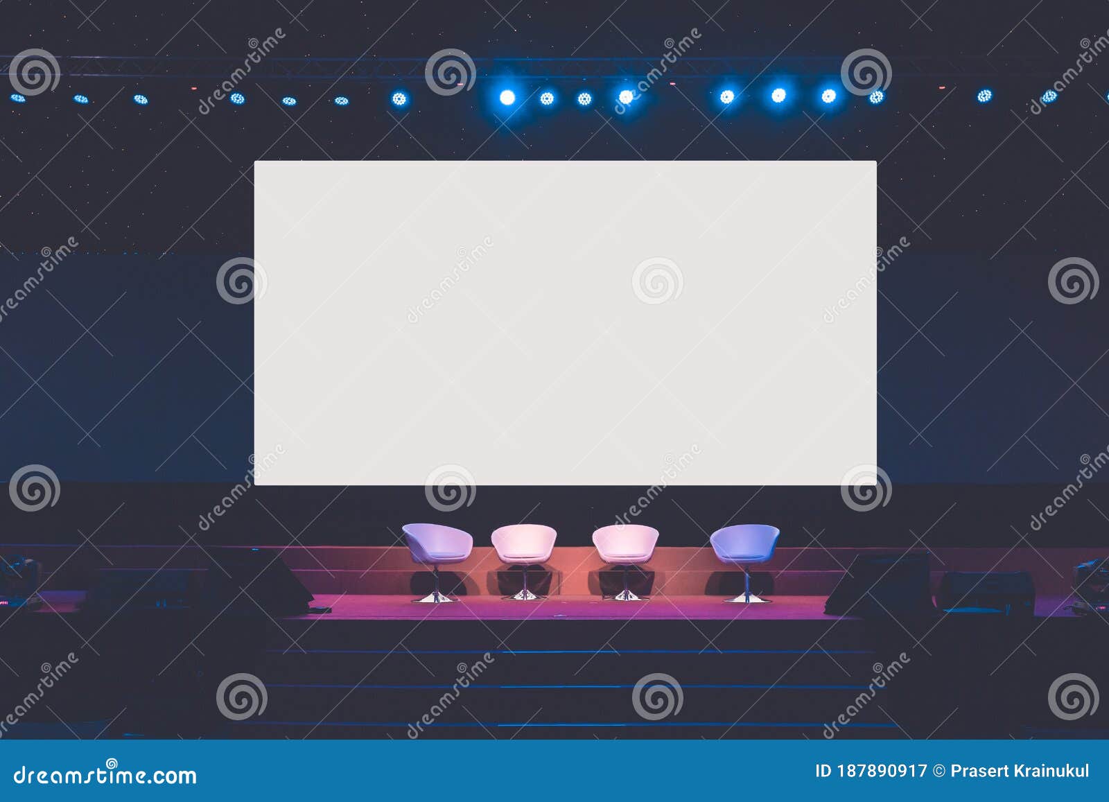 Chairs on Stage in Conference Hall at Business Event or Seminar Meeting
