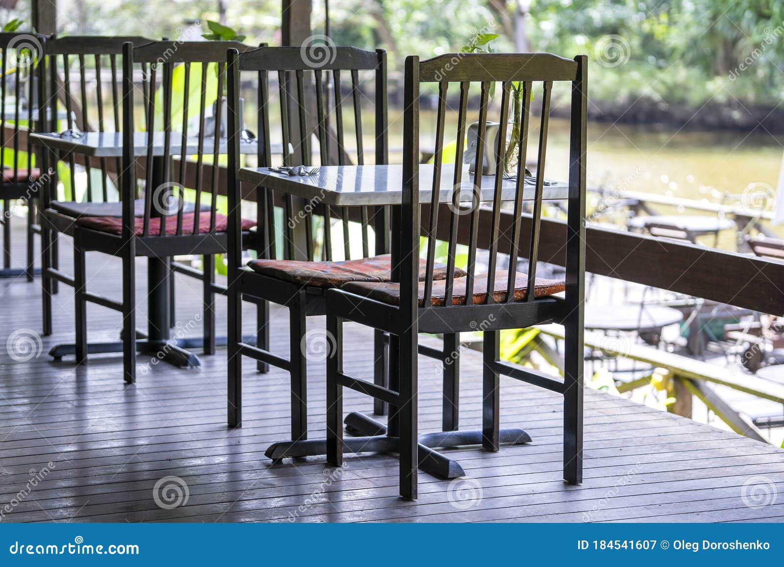 Chairs And Table On The Backyard In Tropical Cafe Near ...