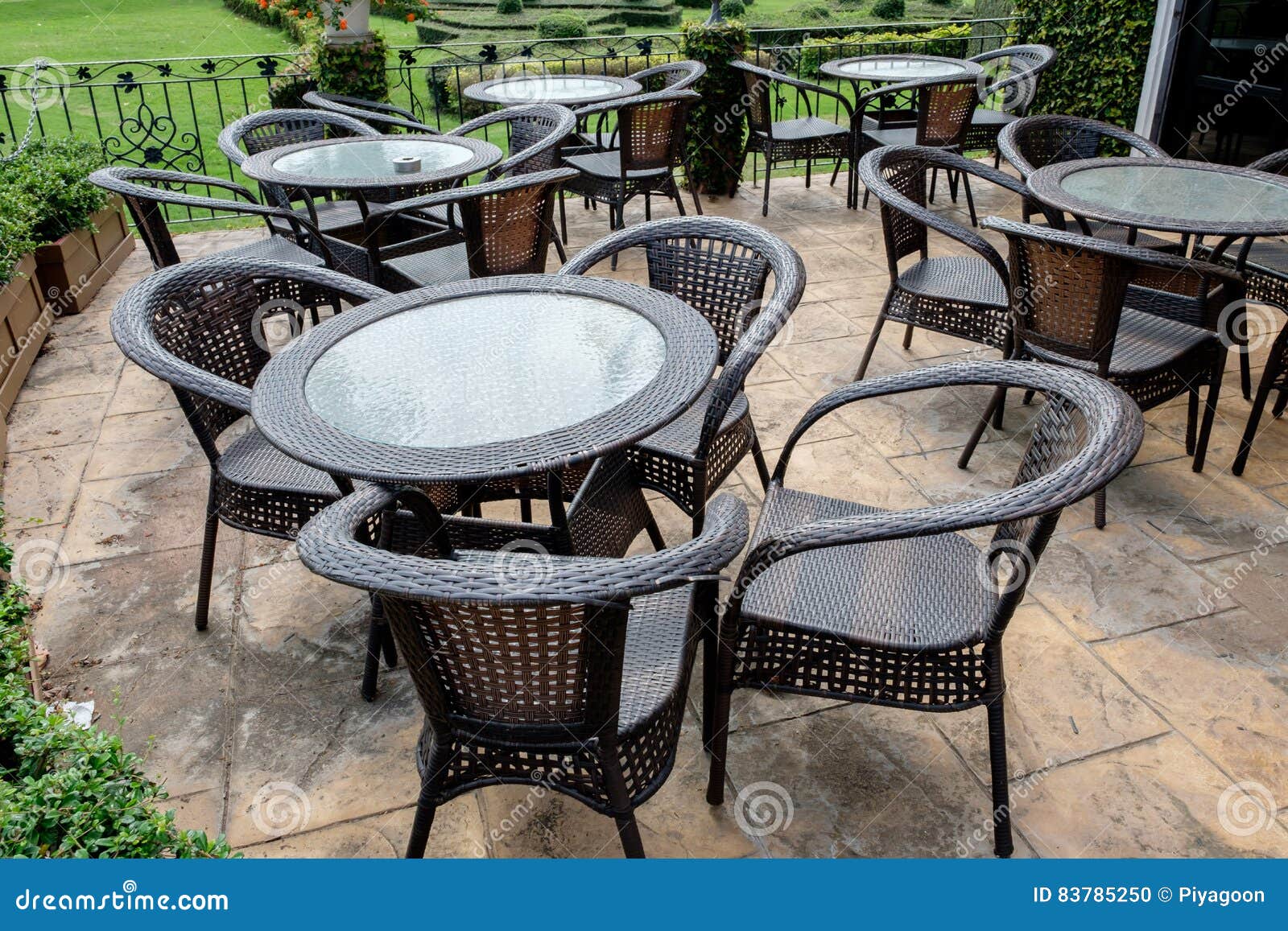 Chairs and Tables of a Restaurant Seating Outside Stock Photo Image