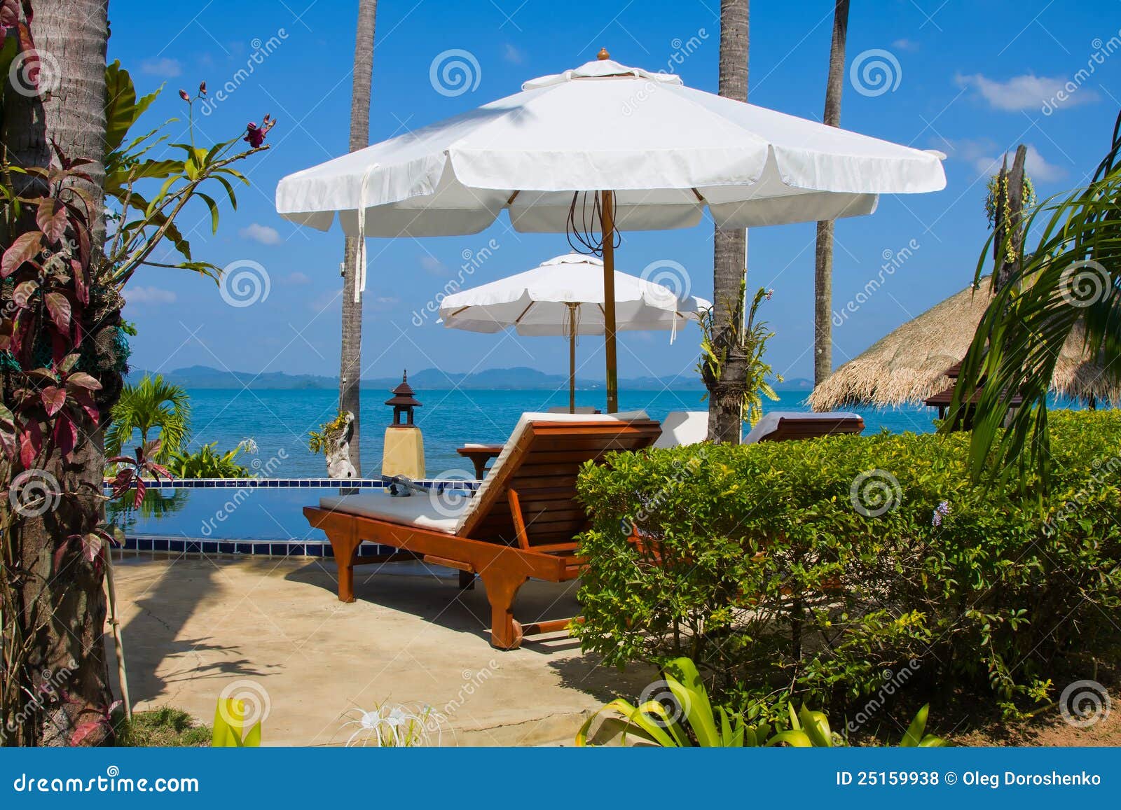 Chaise lounge by the pool stock photo. Image of green 25159938