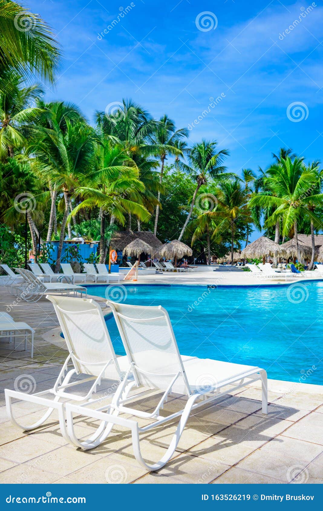 Chaise lounge by the pool stock image. Image of relax 163526219