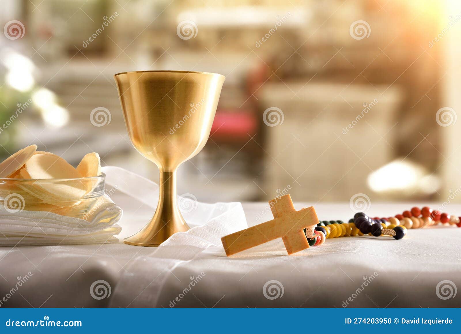 chalice and consecrated host on table at the altar
