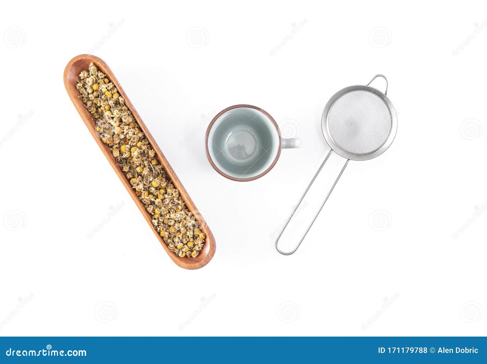 chamomile tea with teacup and strainer or infuser - filter  on white background. top view, overhead