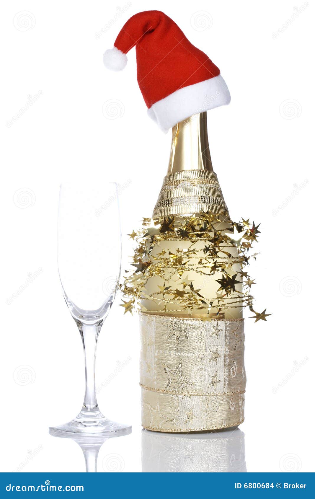 Champagne Bottle With Red Christmas Hat Stock Images 