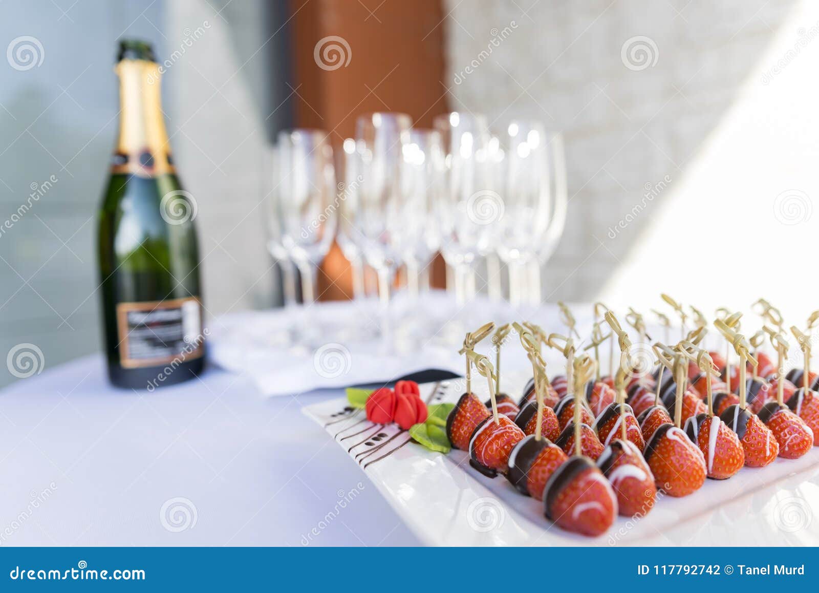 champagne and chocolate covered strawberries served as an appetizer snack and welcome drink