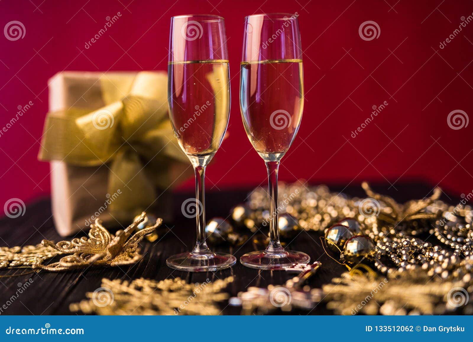 Champagne Glass with Gift Boxes and Christmas Decorations. Present for
