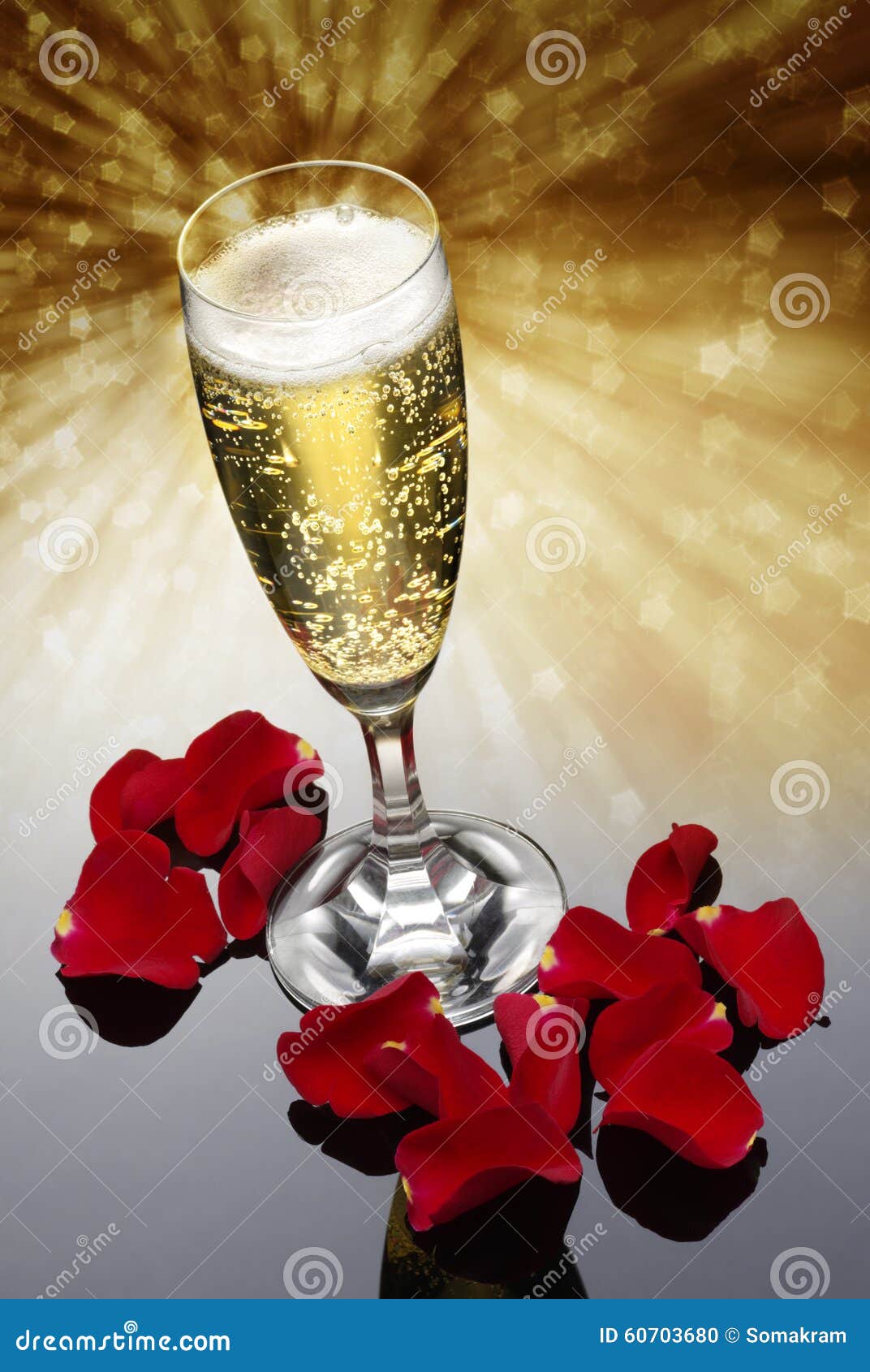 champagne glass and rose petals