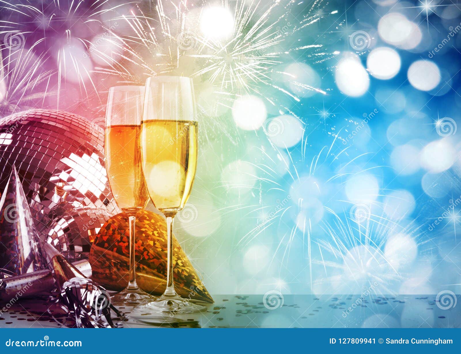 champagne glasses against new years background