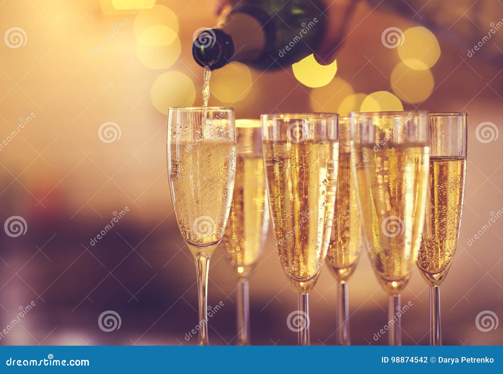 champagne glasses on gold background. party concept