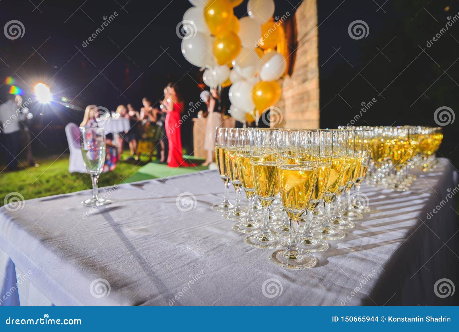 Champagne is Poured into Wine Glasses. Glasses of Champagne Stock Photo