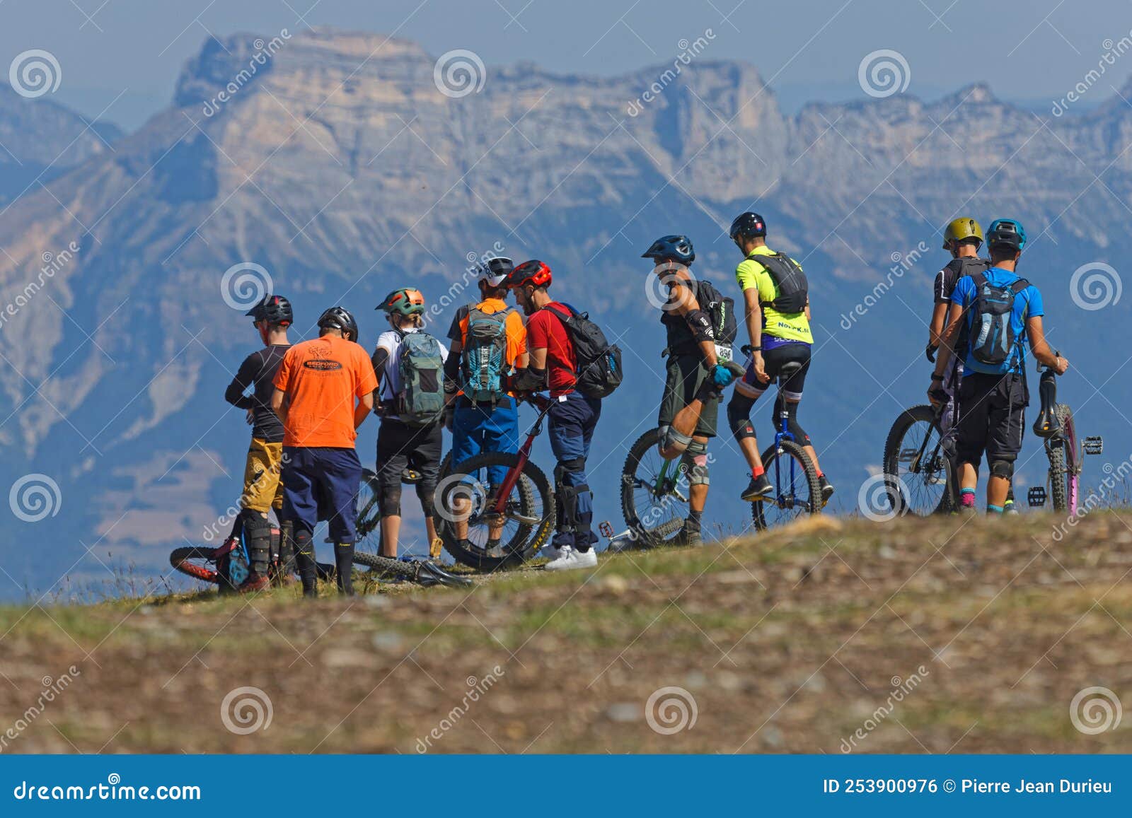 A Group of Unicycle Bikers Admire the Landscape of the Croix De