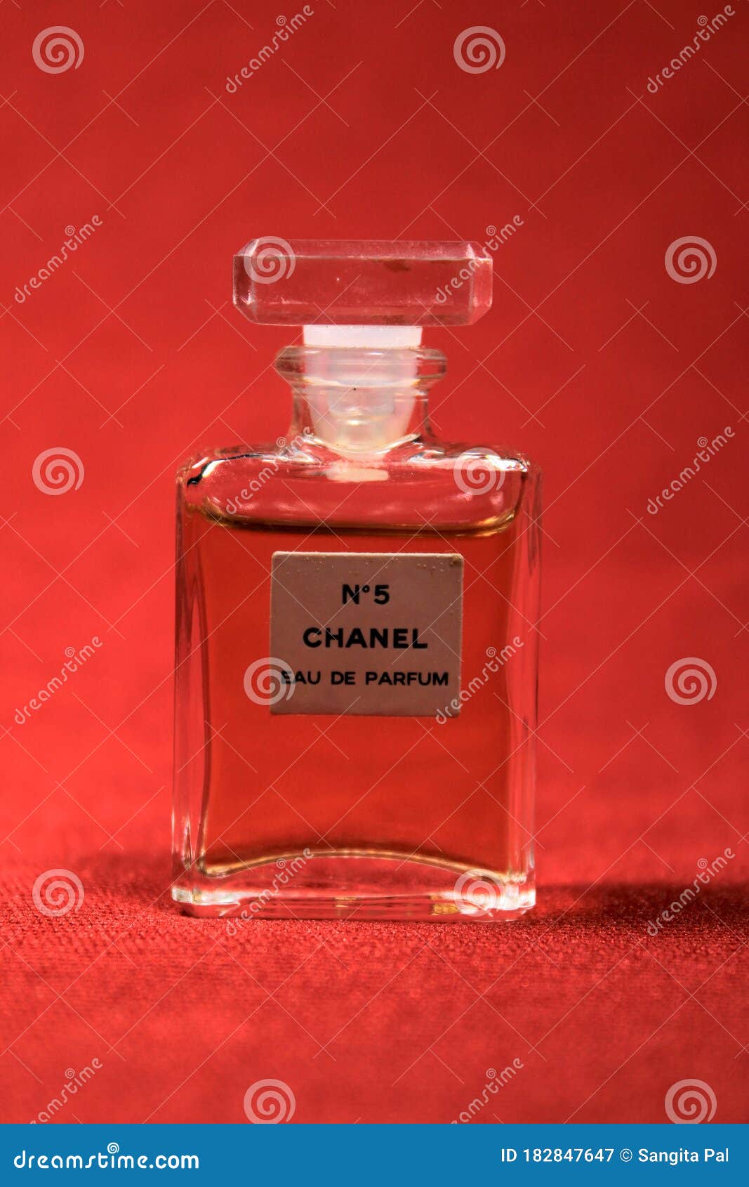 Chanel Perfume Bottles Isolated on Red Background. Bottles with