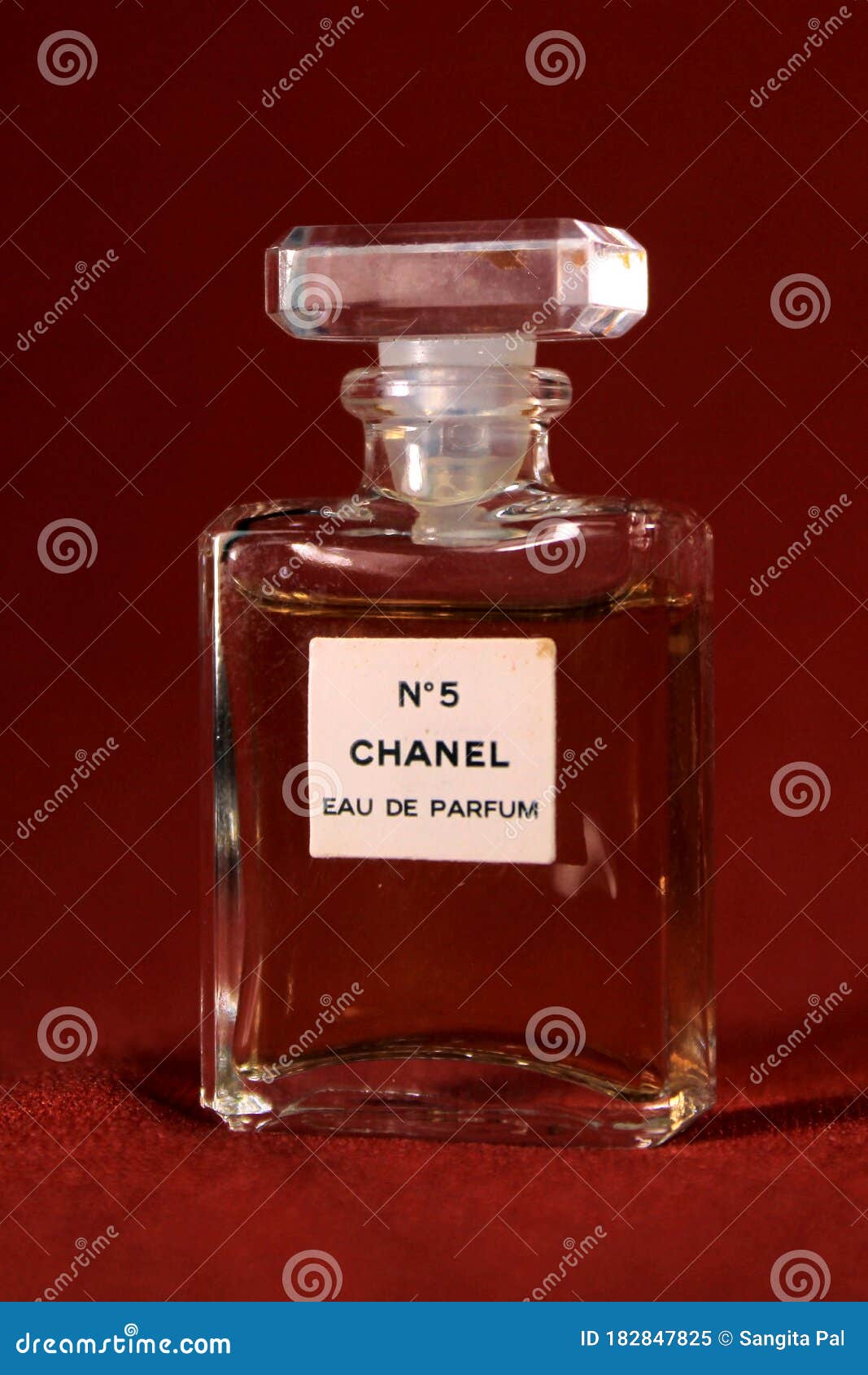 Chanel Perfume Bottle Isolated on Red Background. Bottle with Different ...