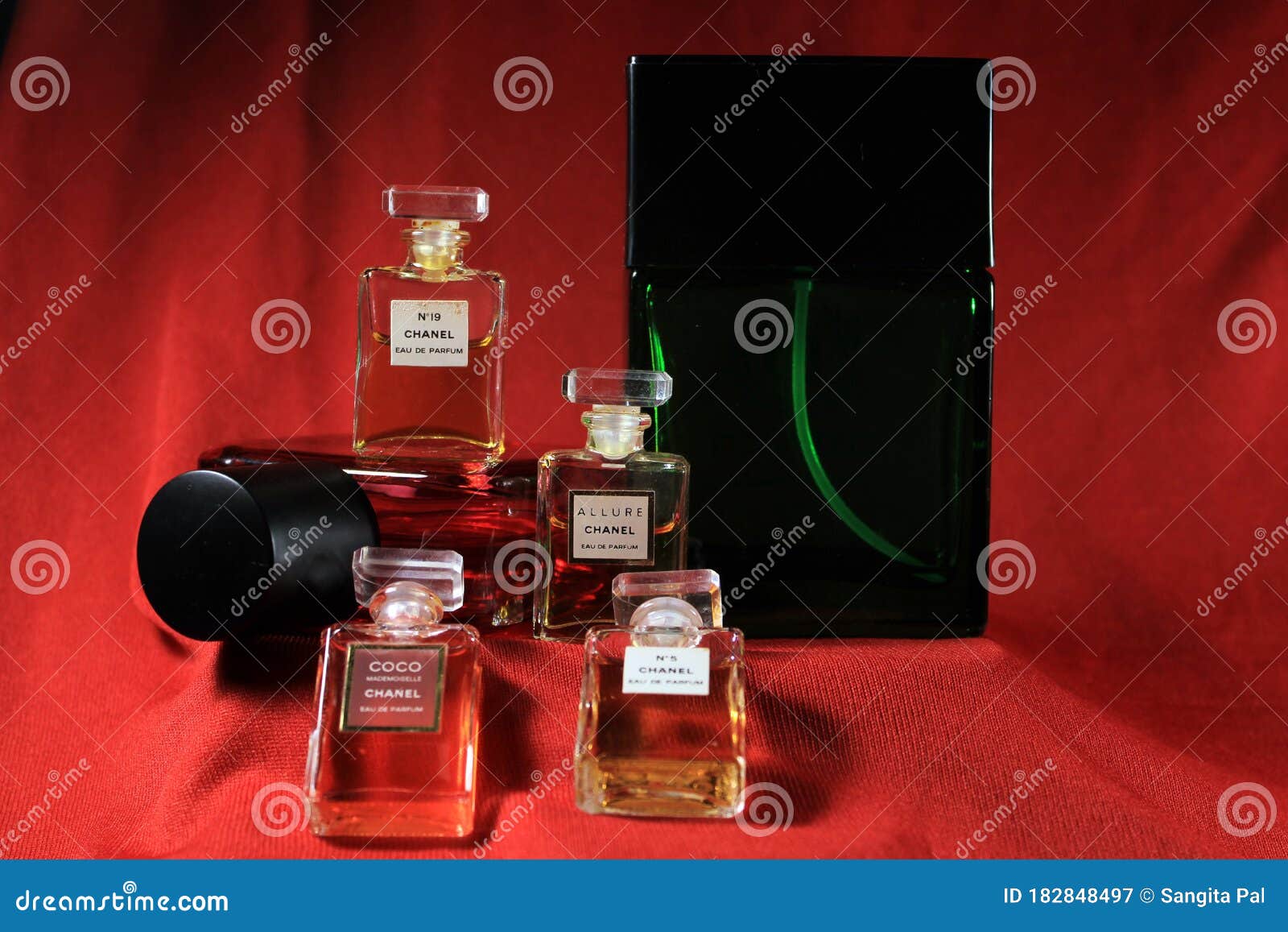 Chanel Perfume Bottles Isolated on Red Background. Bottle with Coco Chanel  & N`5 Chanel Perfume Product. Editorial Photo - Image of famous, colorful:  182848621
