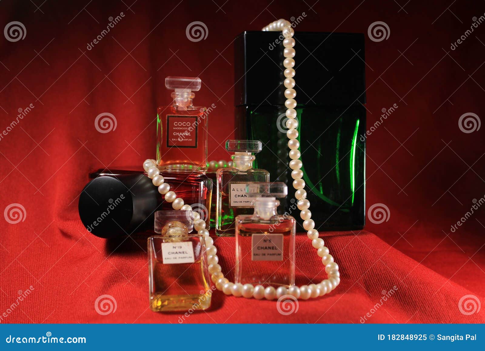 Chanel Perfume Bottles Isolated on Red Background. Bottle with Coco Chanel  & N`5 Chanel Perfume Product. Editorial Image - Image of fashion,  container: 182848925