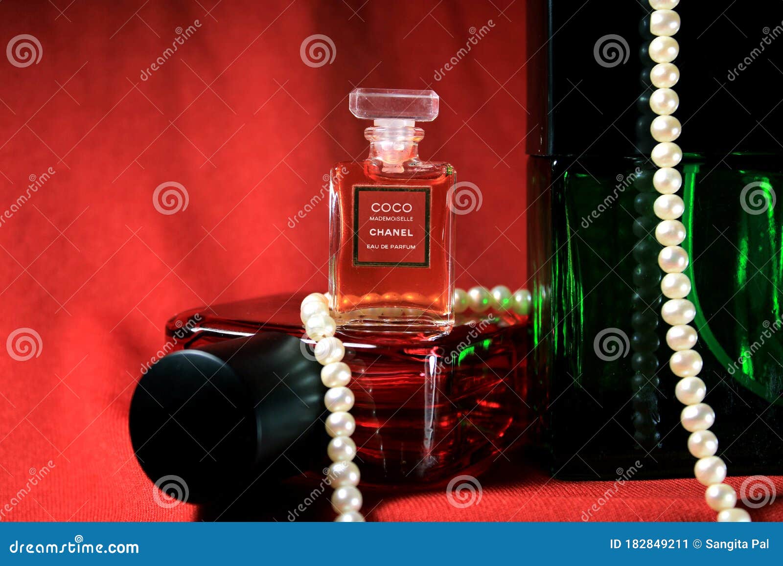 Chanel Perfume Bottles Isolated on Red Background. Bottle with