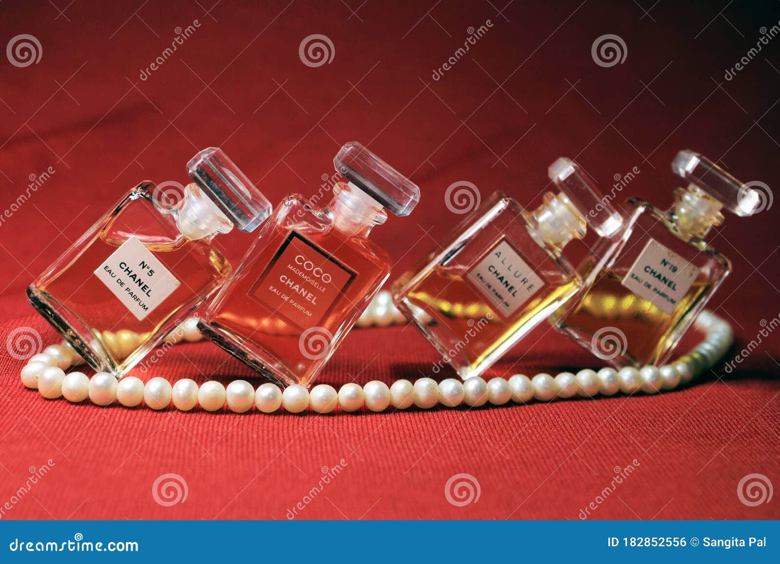 Chanel Perfume Bottles Isolated on Red Background. Bottles with Different Chanel  Perfume Products with Female Accessories Editorial Photo - Image of aroma,  coco: 182852556