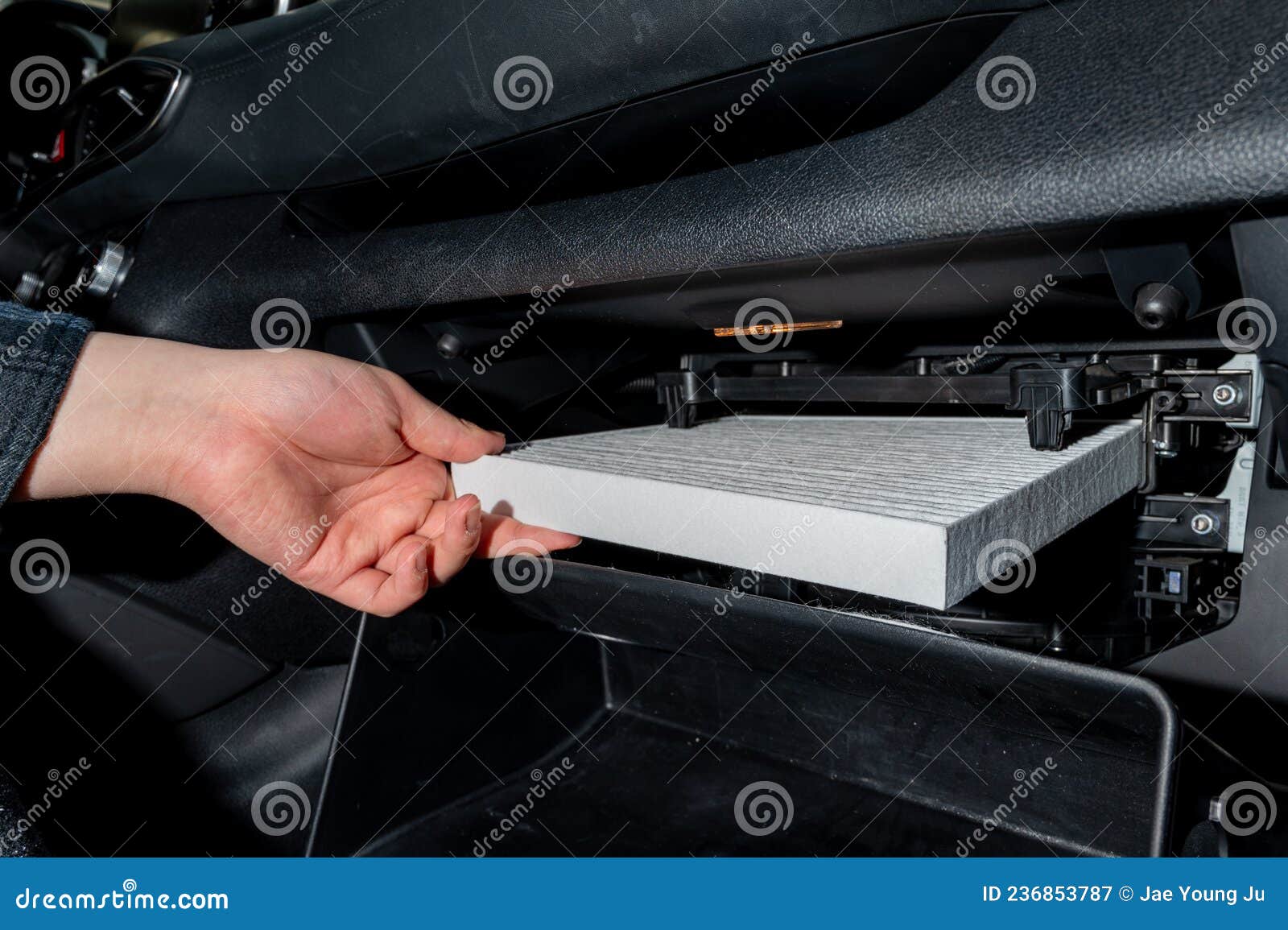 Changing the Air Filter Inside the Car. Car Maintenance Stock Image