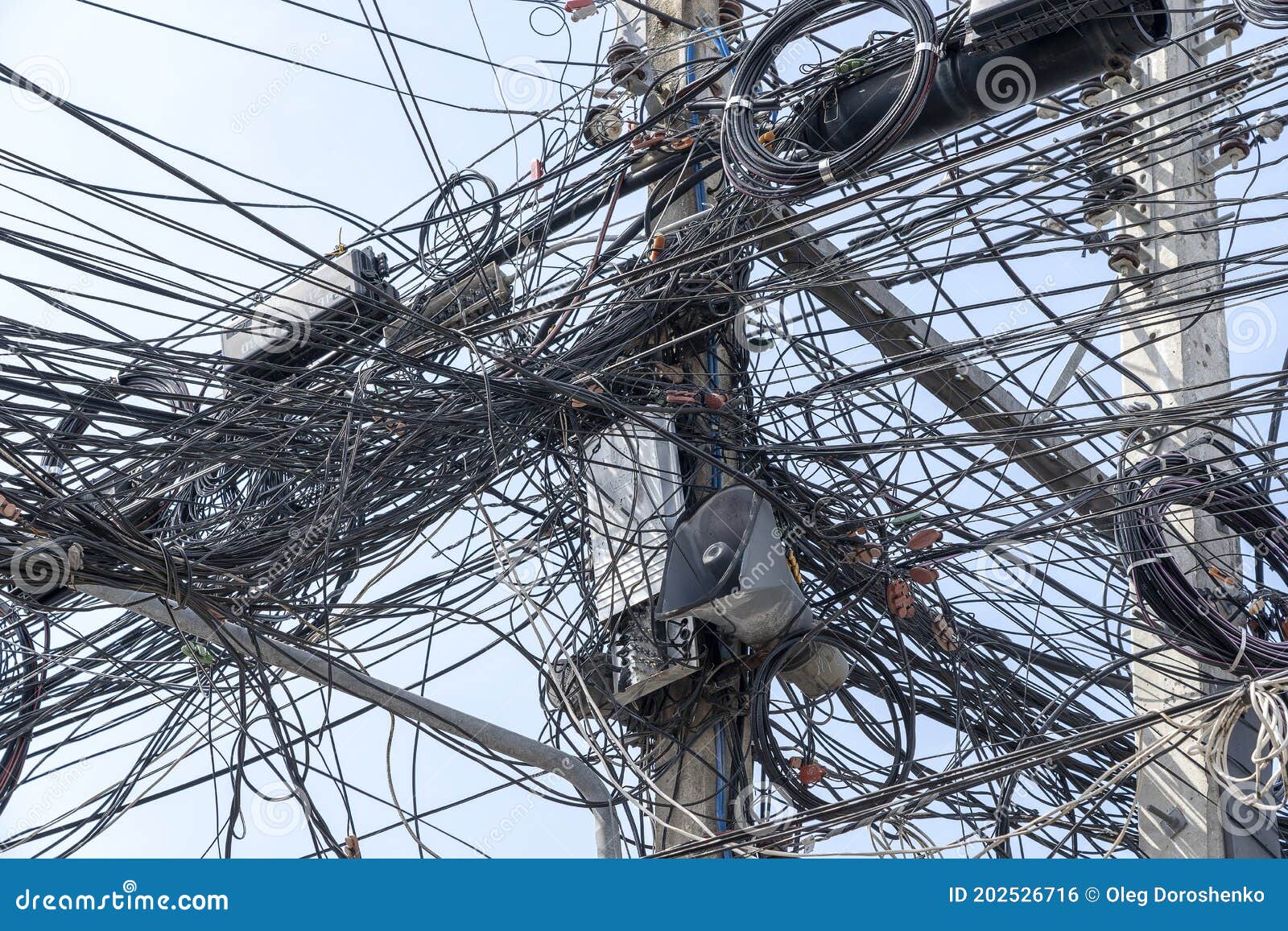 The Chaos Of Cables And Wires On Electric Pole In Bangkok Thailand the-chaos-of-cables-and-wires-on-electric-pole-in-bangkok-thailand