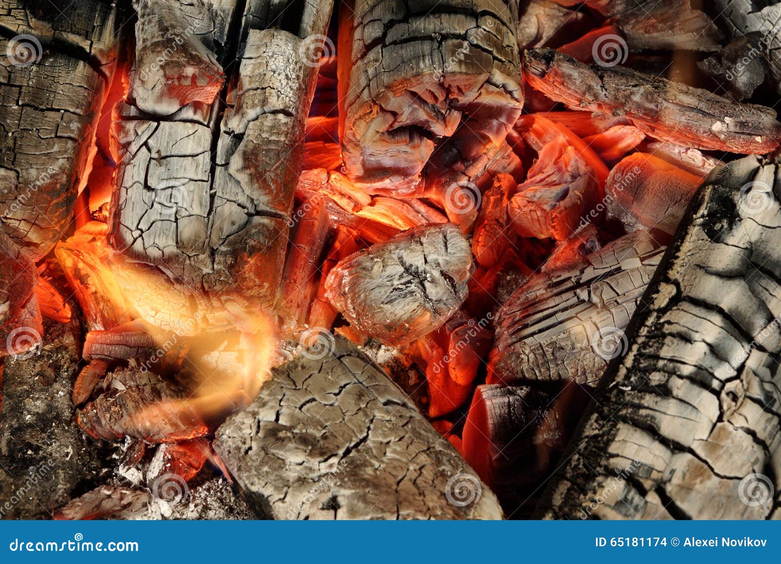 Charcoal Briquettes Glow in BBQ Grill Pit Background Texture Stock