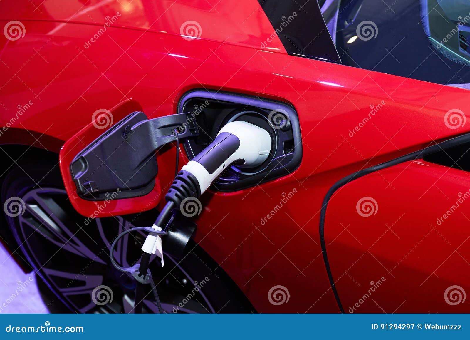 Charging an Electric Car with the Power Cable Supply Plugged in Stock