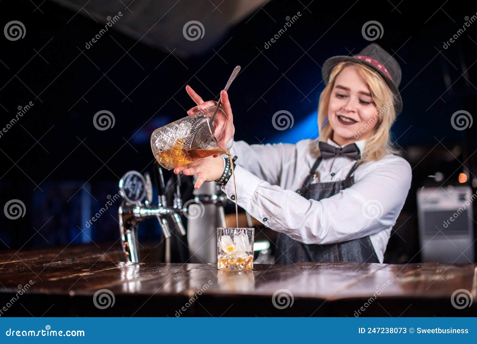 Charismatic Woman Barkeeper Demonstrates the Process of Making a ...