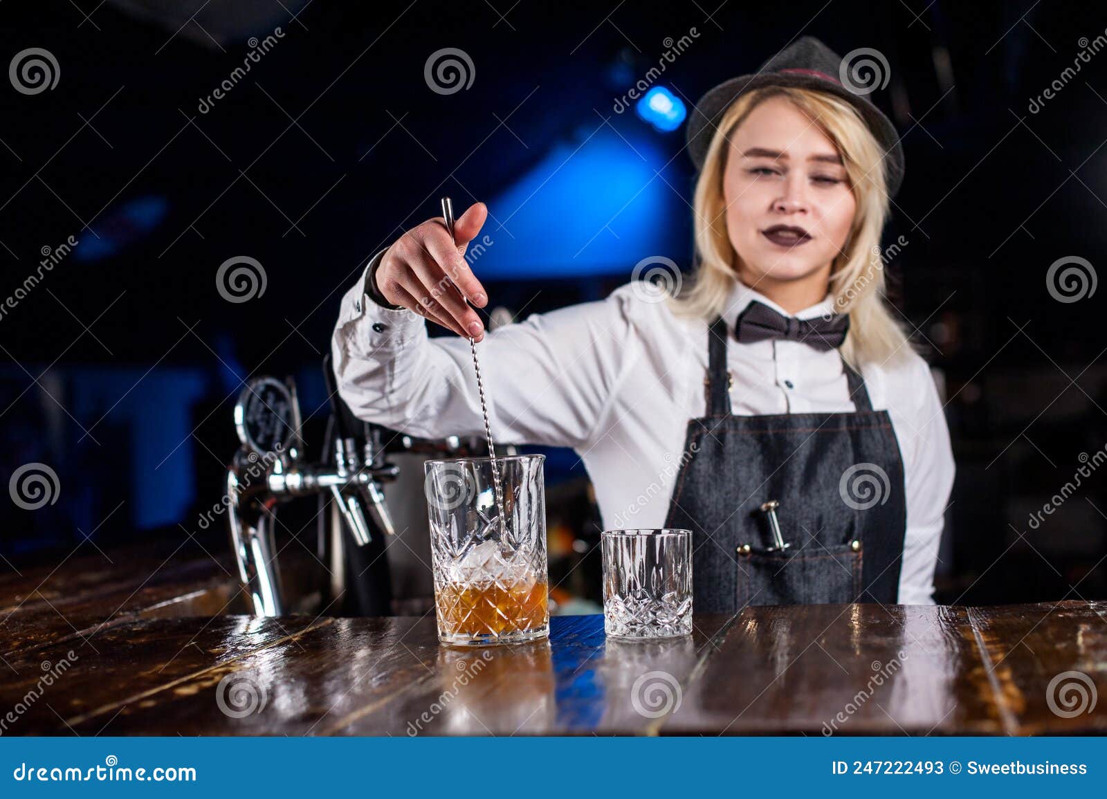 Charismatic Woman Bartending Intensely Finishes His Creation in the Pub ...