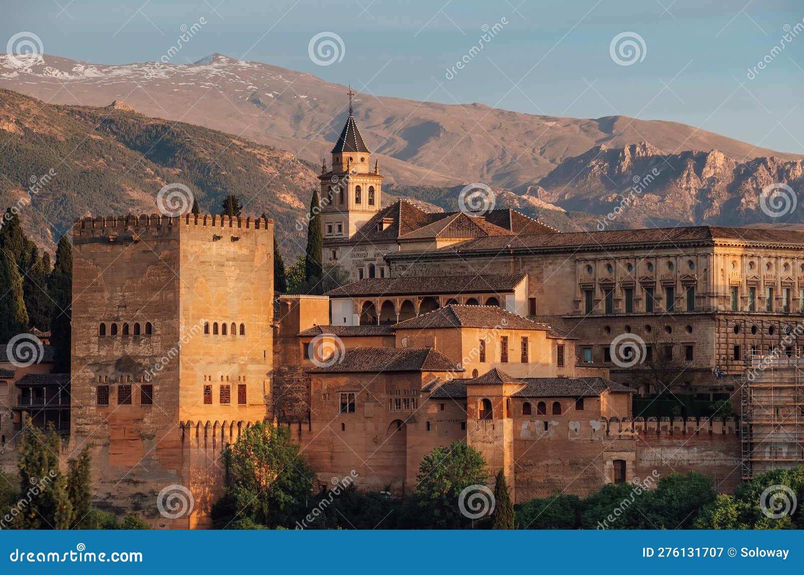 charles v palace and church of santa maria de la alhambra in medieval fortress complex with sierra nevada snowy mountains,