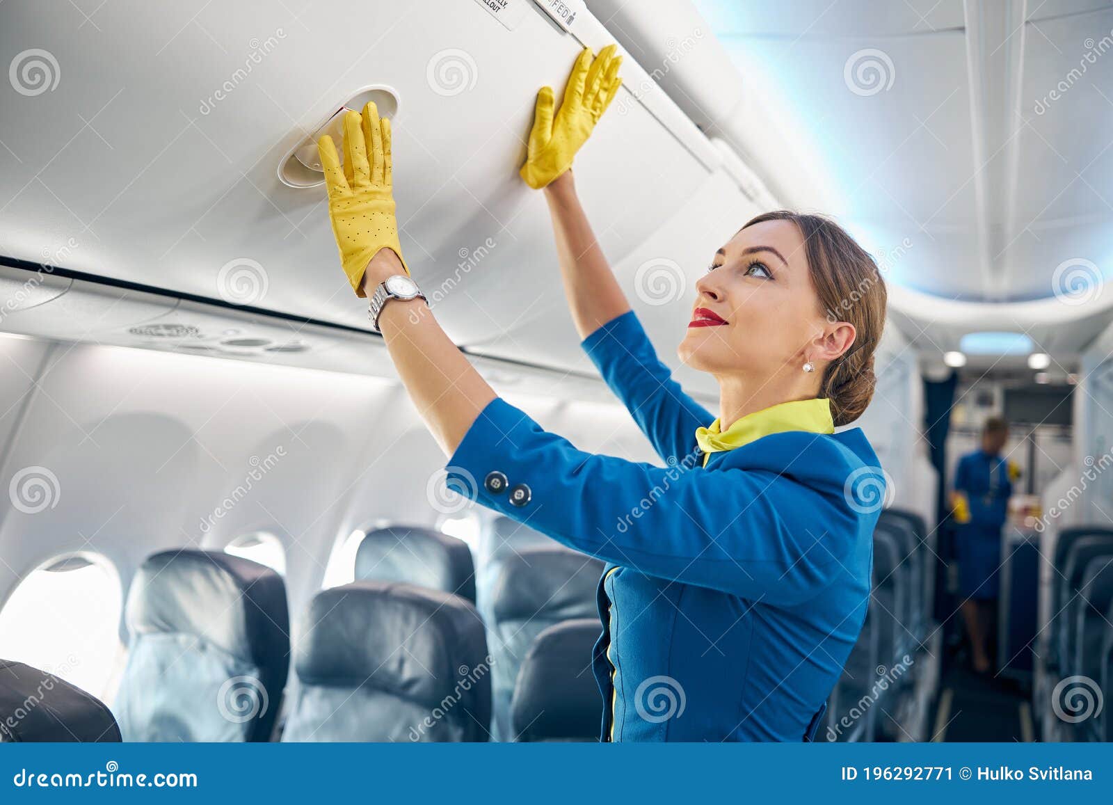 Charming Air Hostess Learning Closing Compartment with Hand Luggage ...