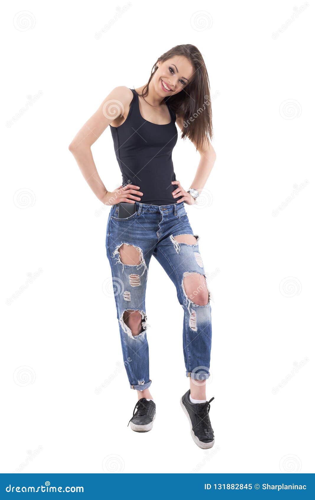 Charming Beautiful Young Female Fashion Model In Ripped Jeans Posing ...