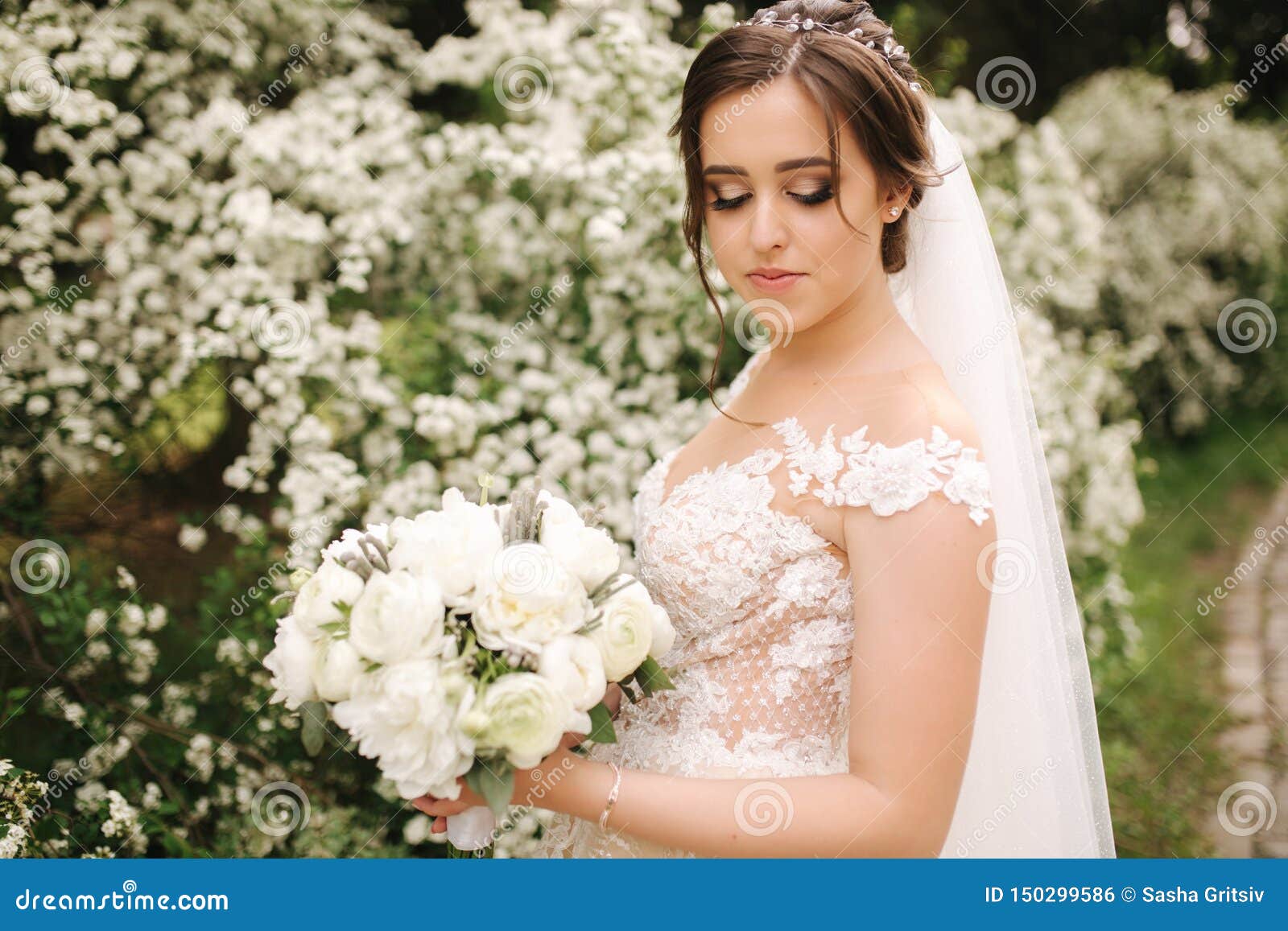 Charming Bride in Gorgeous Wedding Dress Hold Bouquet and Stand in ...