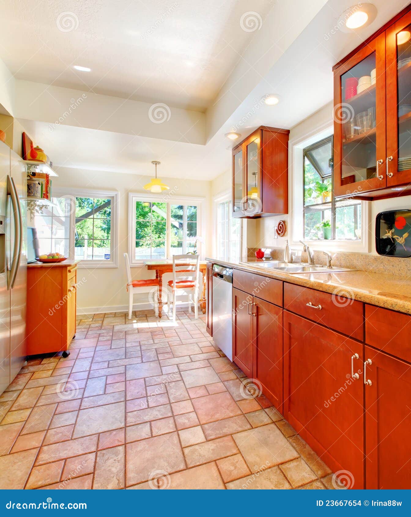 Charming Cherry Wood Kitchen with Tile Floor. Stock Photo Image of