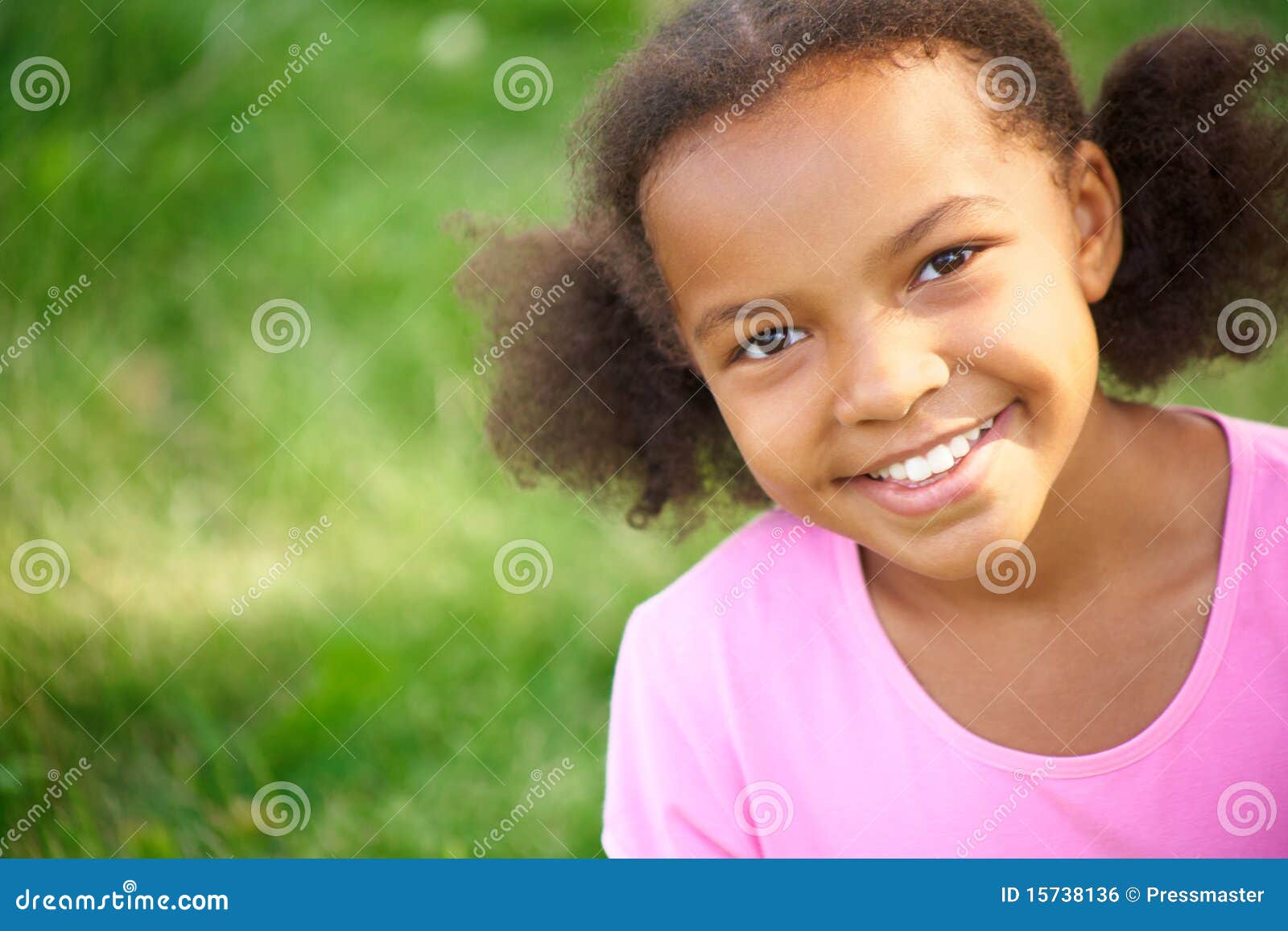 Charming girl. Portrait of cute girl looking at camera and smiling