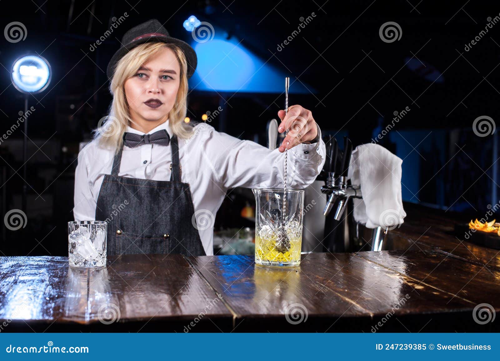 Charming Girl Barman Makes a Cocktail while Standing Near the Bar ...