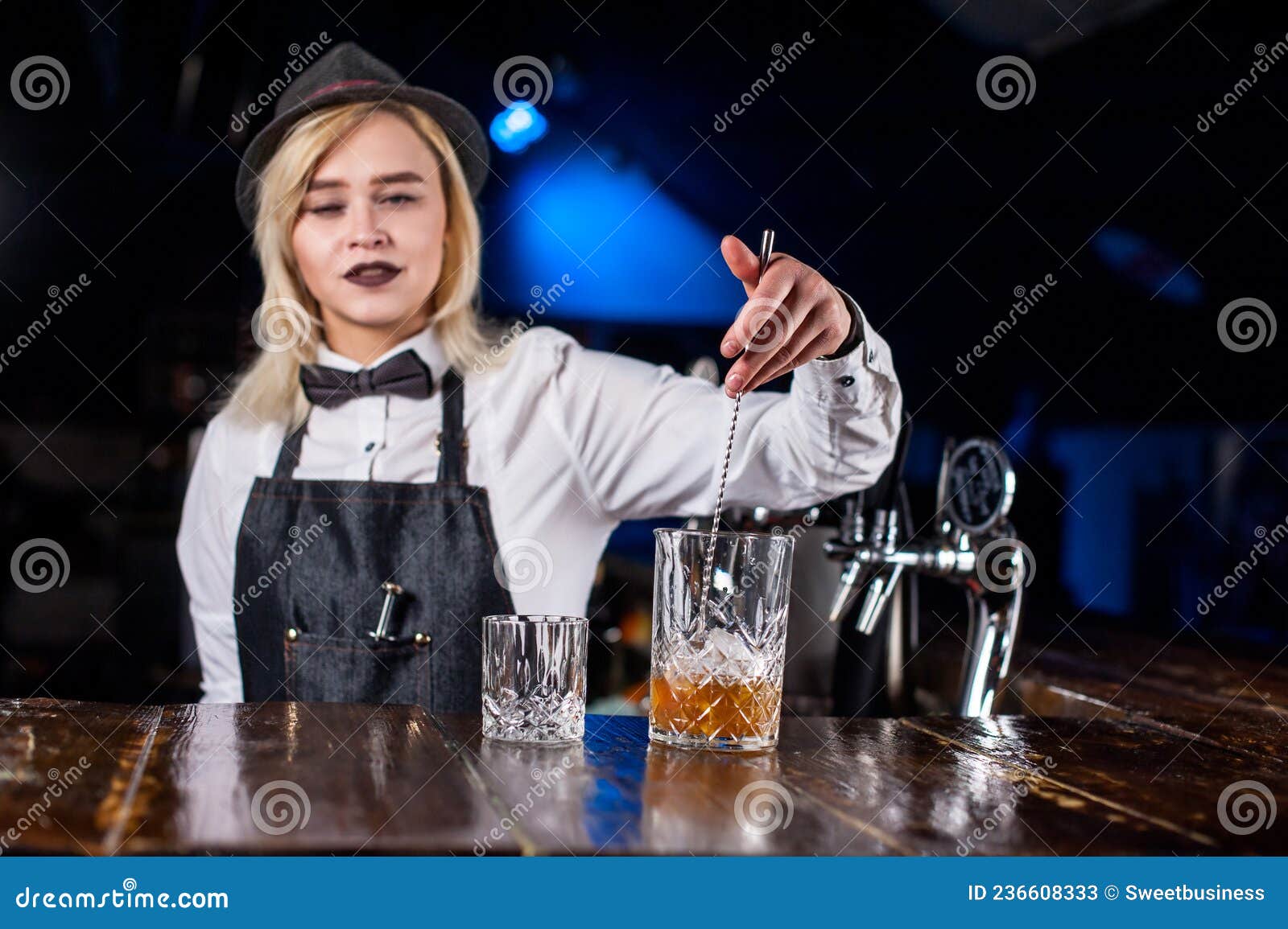 Charismatic Woman Bartending Intensely Finishes His Creation in the Pub ...