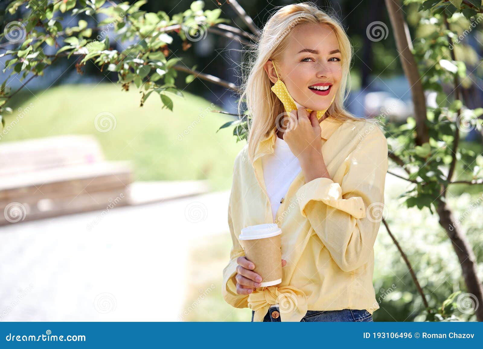 charming happy woman enjoys sunny day
