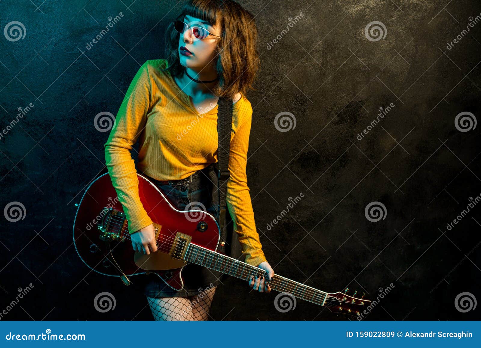 Charming Hipster Woman with Curly Hair with Red Guitar in Neon Lights. Rock  Musician is Playing Electrical Guitar Stock Image - Image of background,  bass: 159022809