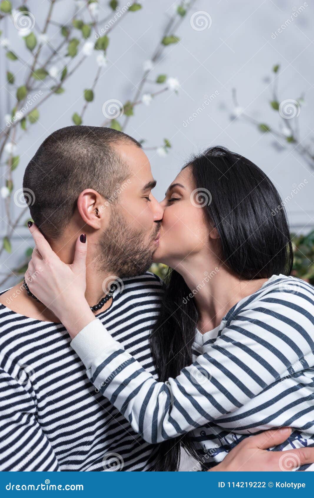 https://thumbs.dreamstime.com/z/charming-international-couple-striped-sweaters-kissing-hu-charming-international-couple-striped-sweaters-kissing-114219222.jpg