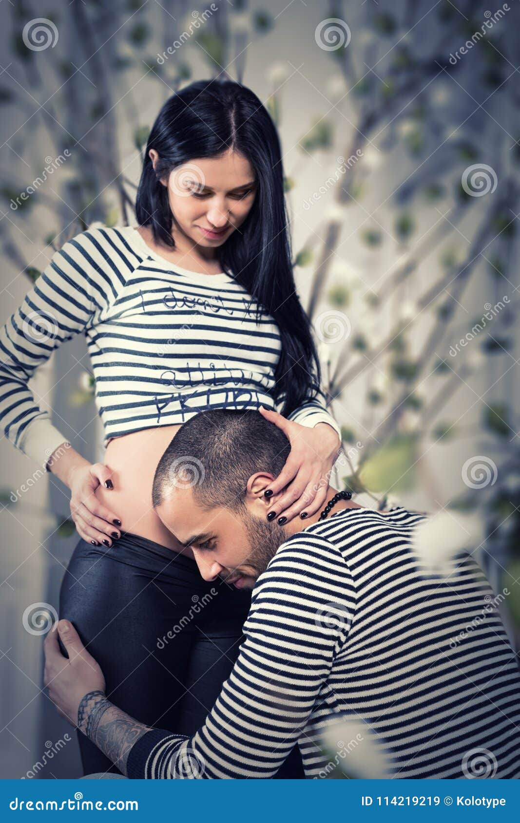 https://thumbs.dreamstime.com/z/charming-international-couple-striped-sweaters-look-each-other-muslim-men-sat-down-listening-belly-his-pregnant-114219219.jpg