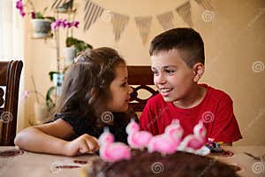 Charming Kids Boy And Girl Brother And Sister Having Fun Sitting At Charming Kids Boy And Girl Brother And Sister Having Fun Sitting At